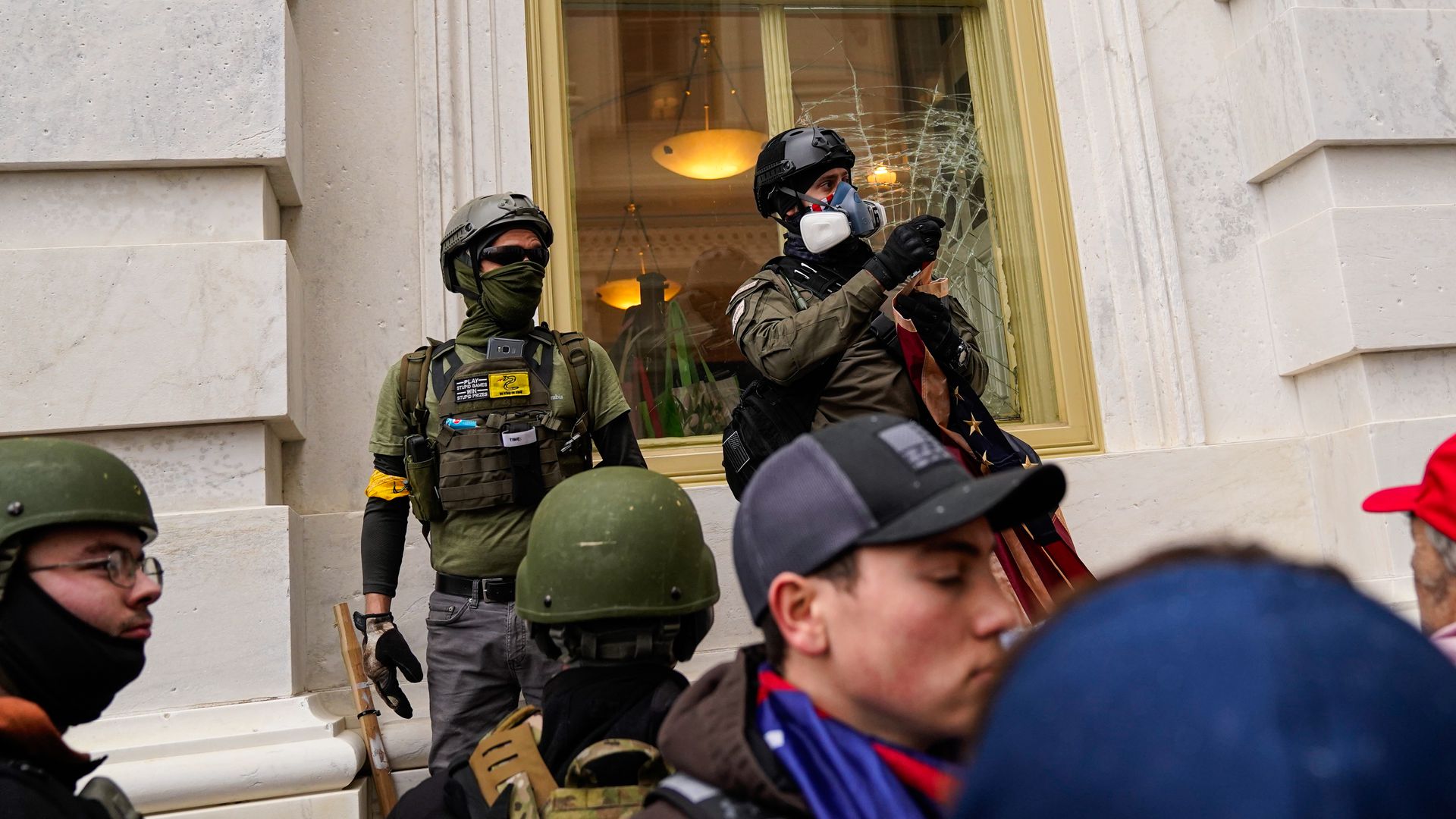 Rioters at the Jan 6 Capitol wearing military gear.