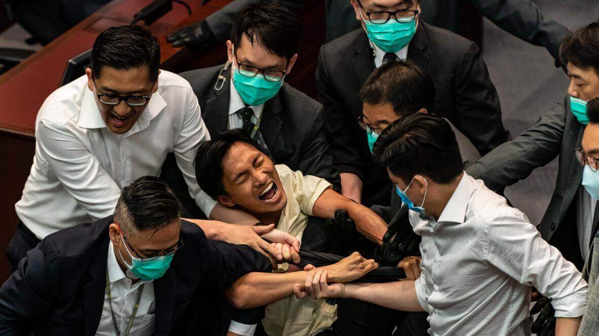 Pro-Democracy Lawmakers in Hong Kong Dragged out of Legislative Council Over New Law