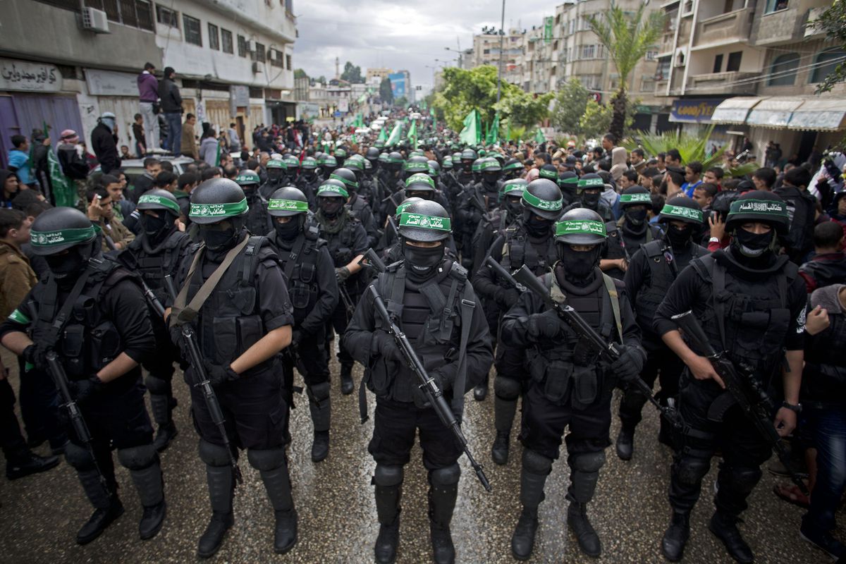 Members of the Izz ad-Din al-Qassam Brigades parade during Hamas’ 27th anniversary celebration in 2014. 
