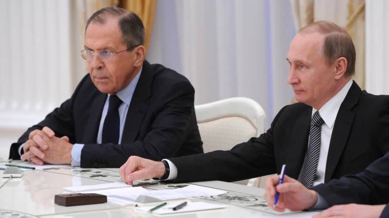 Russian President Vladimir Putin (R) with Foreign Minister Sergey Lavrov.