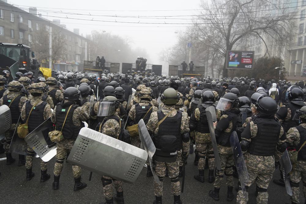 Riot police block a street to prevent demonstrators during a protest in Almaty, January 5, 2022.