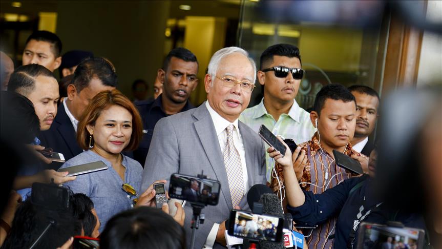 Former Malaysian Prime Minister Najib Razak (C)