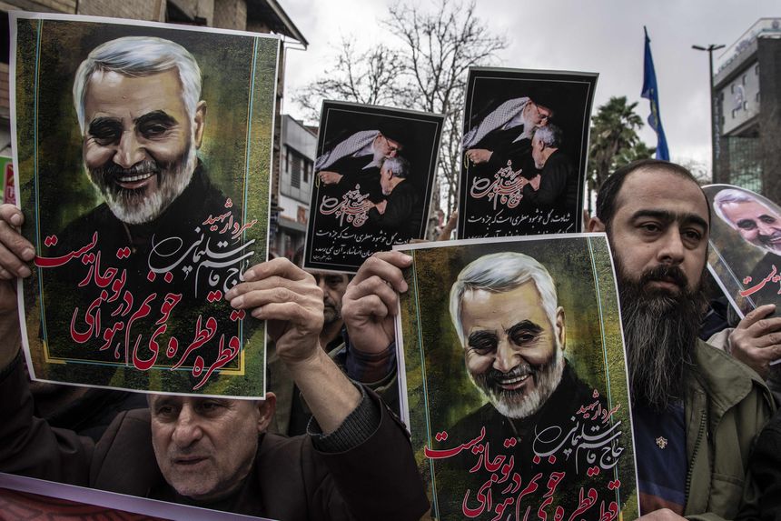 Iranian holding pictures of Quds Force General Qassem Soleimani, Tehran, 2020