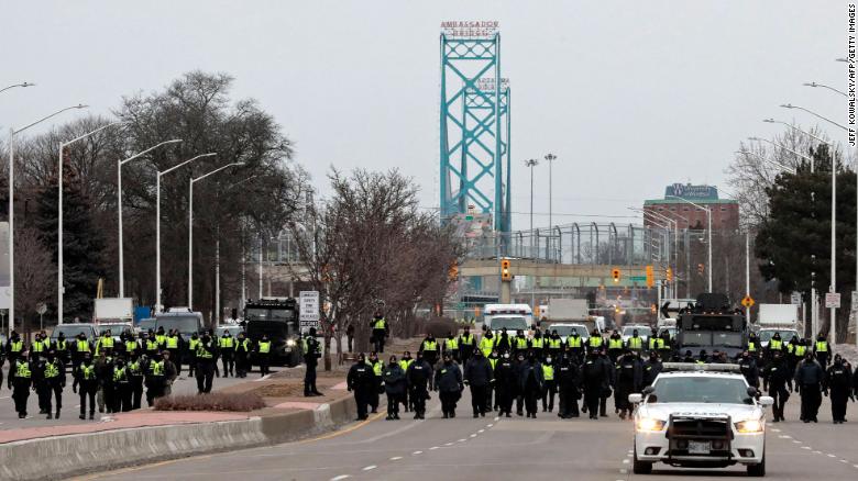 Police at the Ambassador Bridge, which connects Windsor, Ontario with Detroit, Michigan. 