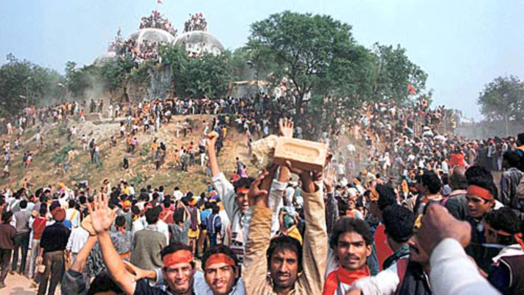 Hindu Mobs stormed the gates to demolish the Babri Masjid in 1992.